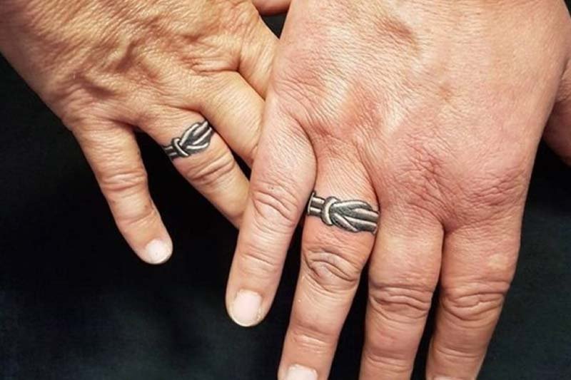 Black and white ring tattoos