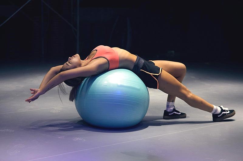 3 Ways a Fitness Ball Can Improve a Woman's Strength