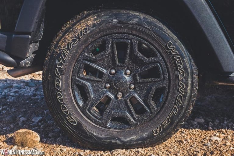 putting air in tyres at petrol station